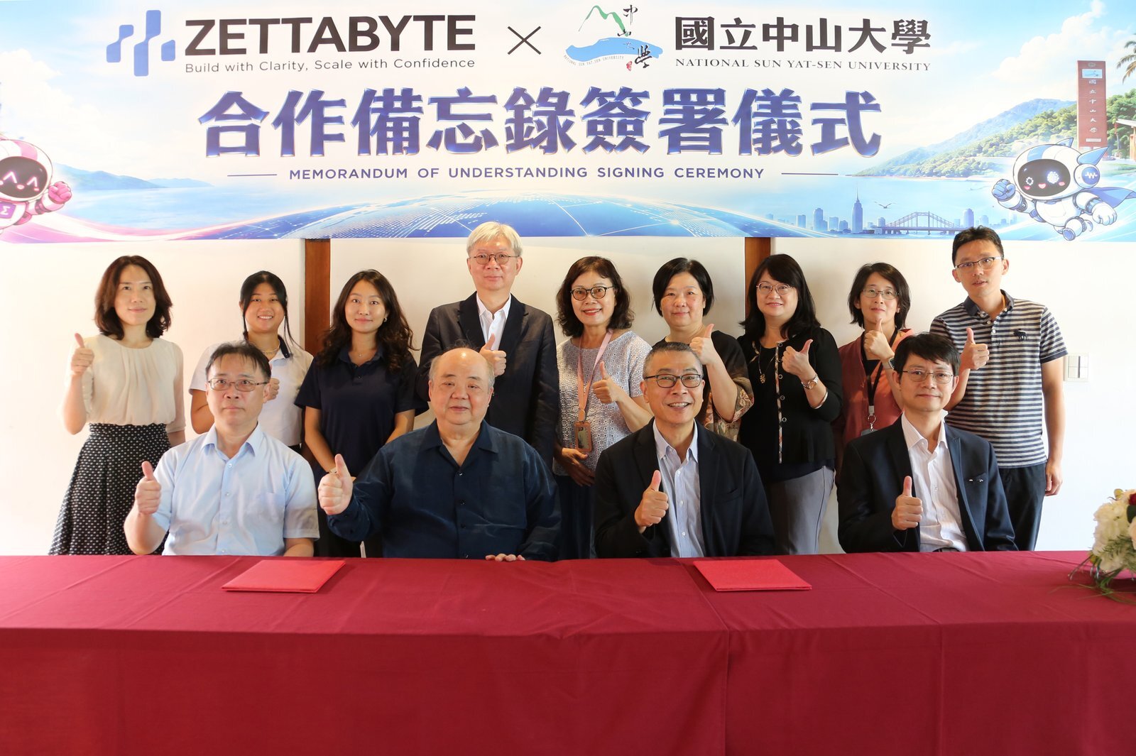 Representatives of Zettabyte and National Sun Yat-sen University pose together after the signing ceremony, with Kenneth Tai and Chih-Wen Kuo seated at the centre.